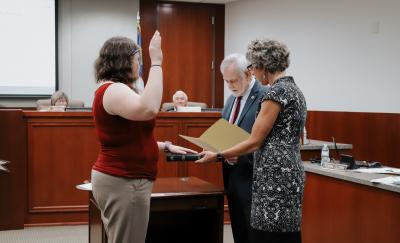 Katie Rhyne takes an oath of office as Acting Planning Director